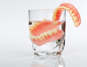 dentures in a glass